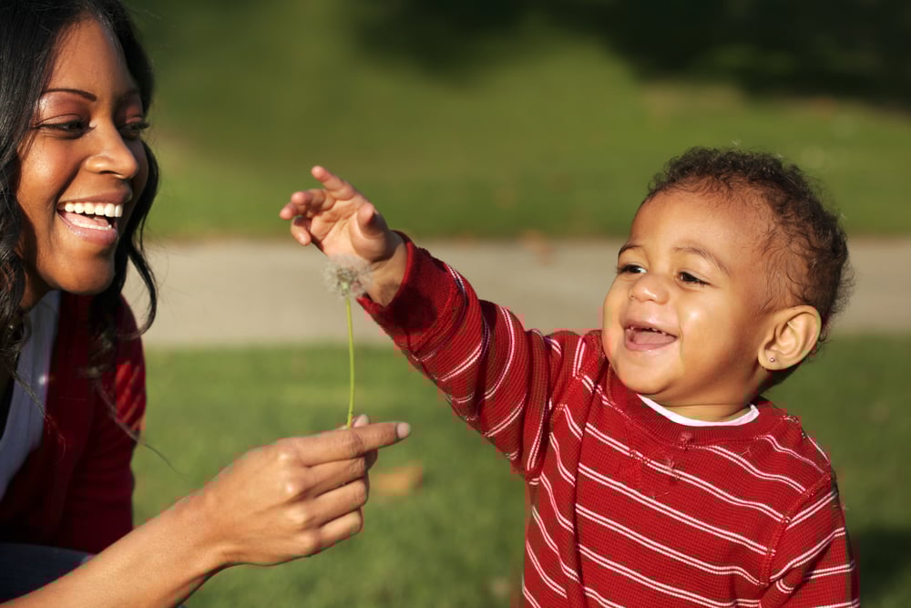 toddler_femaleCG_outside_smile_flower